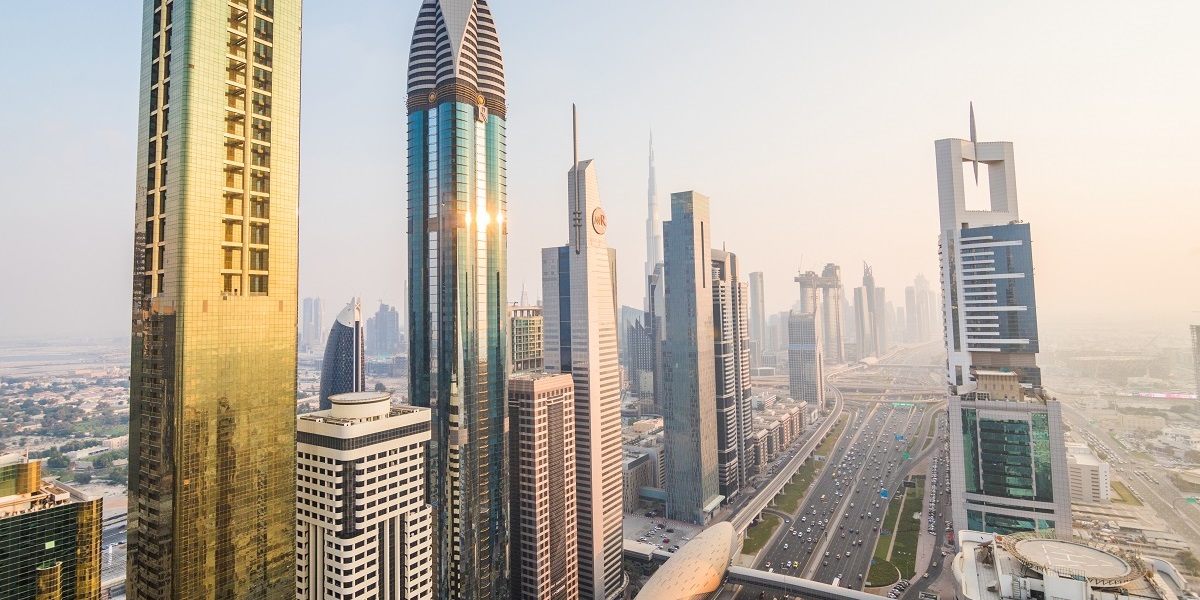 Dubai, UAE - October, 2018. Dubai skyline and downtown skyscrapers on sunset. Modern architecture with highrise buildings on world famous metropolis in United Arab Emirates